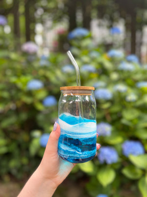 iced coffee glass tumbler hand painted to look like the ocean, woman holding