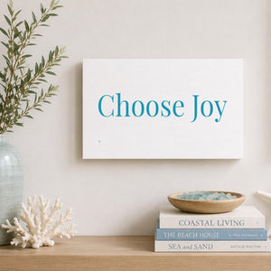 Choose Joy Wood white sign hanging on wall with coastal decor